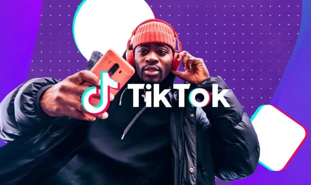 man holding whole with tiktok logo superimposed