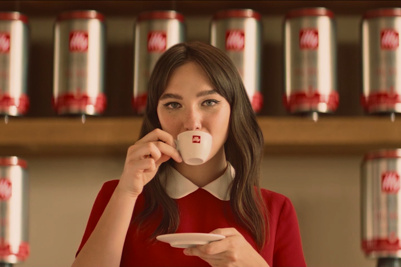 woman sipping out of illy mug