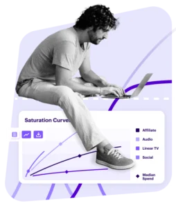 man sitting on laptop on top of data