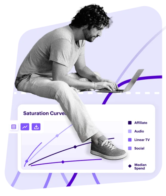 man sitting on laptop on top of data