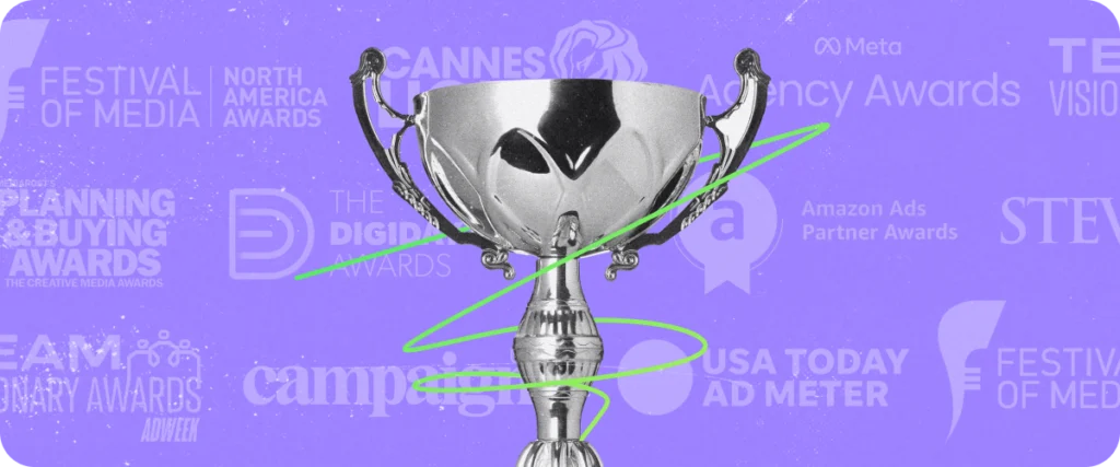 A trophy with different awards listed in the background.