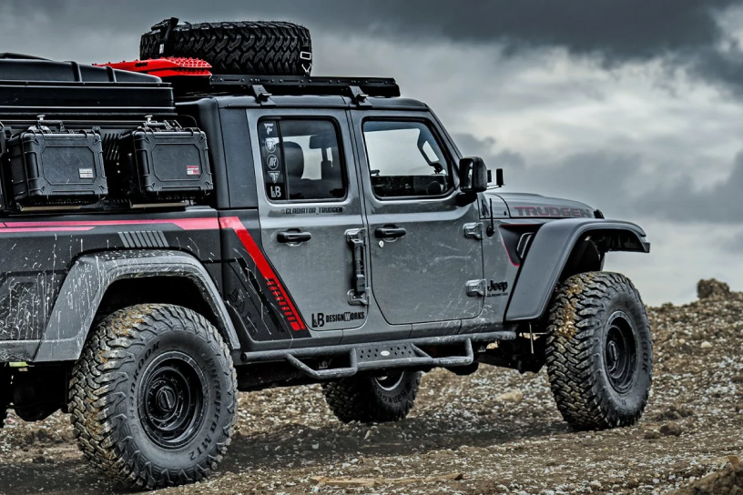 jeep with accessories driving over rocky terrain