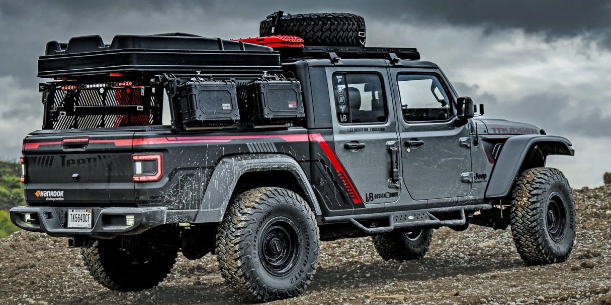 jeep with accessories driving over rocky terrain