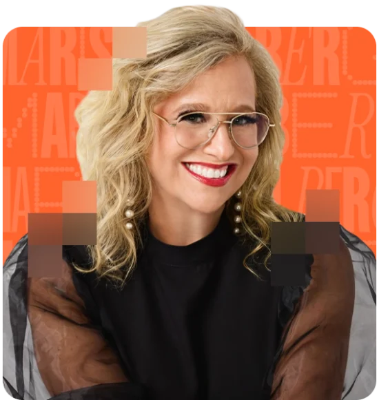 woman wearing glasses smiling at the camera