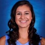 girl with dark hair smiling