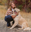 girl and dog posing for a photo