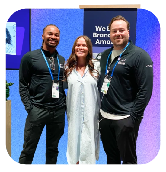 three people smiling at the camera