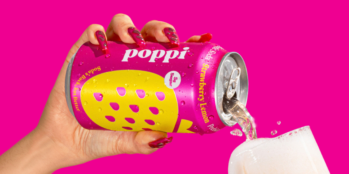 woman pouring poppi soda
