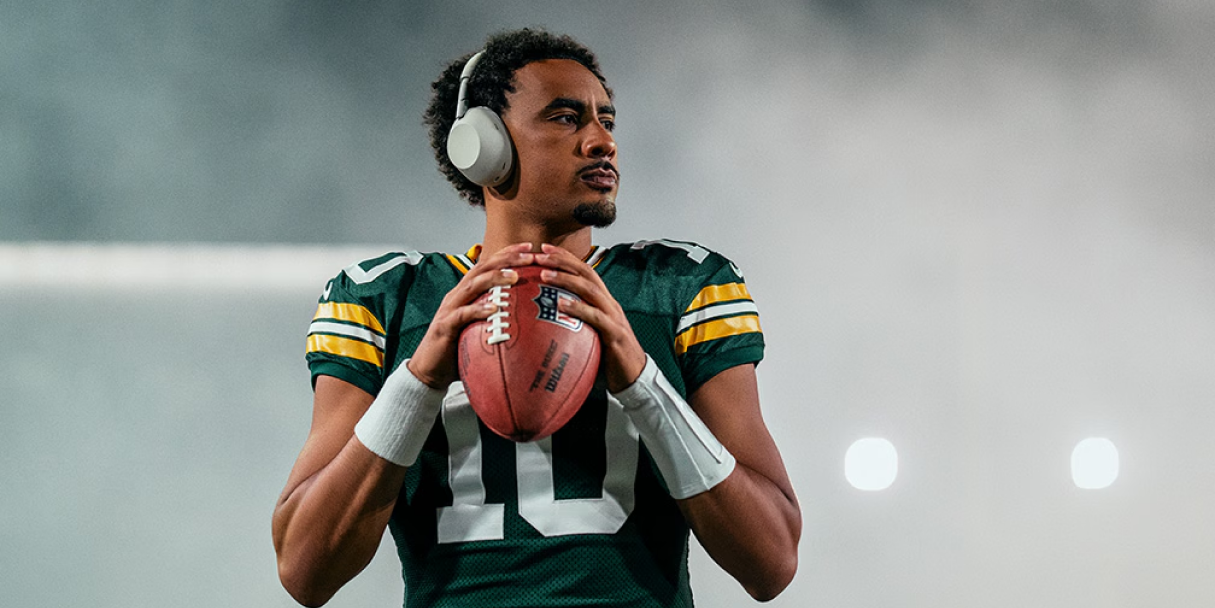 football player wearing Sony headphones