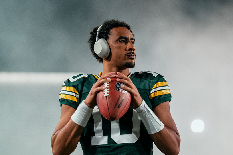 football player wearing Sony headphones